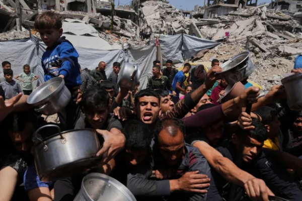 At Least 22 Palestinians Killed by Israeli Gunfire Near Gaza Aid Distribution Sites At Least 22 Palestinians Killed by Israeli Gunfire Near Gaza Aid Distribution Sites